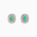 The 18K Two-Tone Gold Paraiba and Diamond Cushion Halo Stud Earrings feature oval Paraiba gemstones set in gold, surrounded by two rows of round white diamonds in a rectangular halo design.