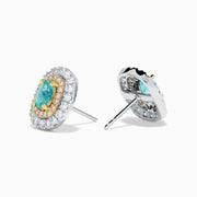The 18K Two-Tone Gold Paraiba and Diamond Cushion Halo Stud Earrings feature oval Paraiba gemstones set in gold, surrounded by two rows of round white diamonds in a rectangular halo design.
