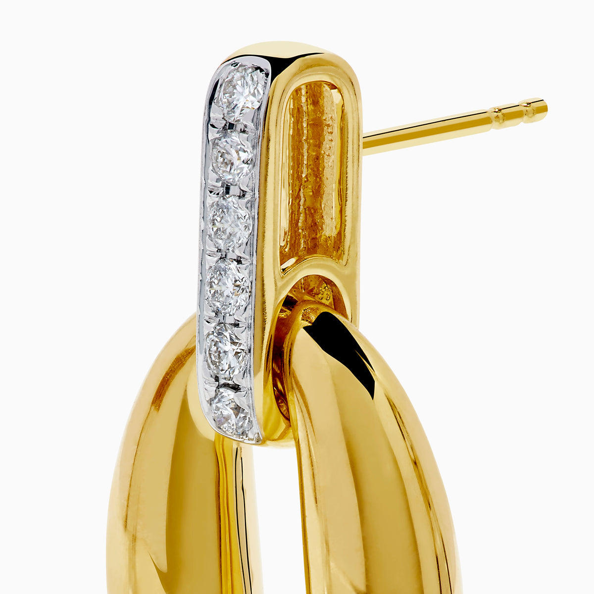 The 14K Yellow Gold Diamond Accented Sculptural Oval Drop Earrings feature vertical bars with sparkling diamond accents atop oval drops, shown against a white background.