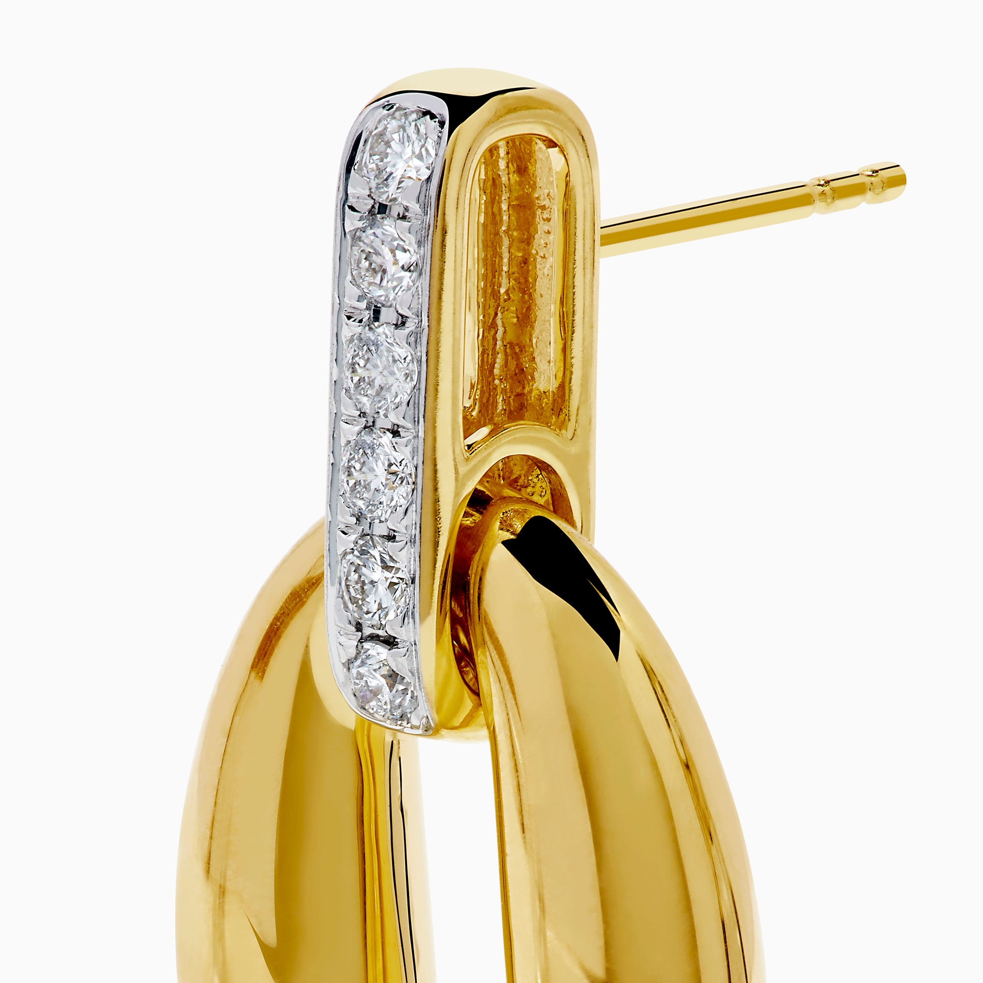 The 14K Yellow Gold Diamond Accented Sculptural Oval Drop Earrings feature vertical bars with sparkling diamond accents atop oval drops, shown against a white background.