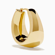 The 14K Yellow Gold High-Polish Tapered Wide Hoop Earrings feature a sleek, modern design with a sculptural, high-shine finish, shown against a plain white background.