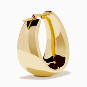 The 14K Yellow Gold High-Polish Tapered Wide Hoop Earrings feature a sleek, modern design with a sculptural, high-shine finish, shown against a plain white background.