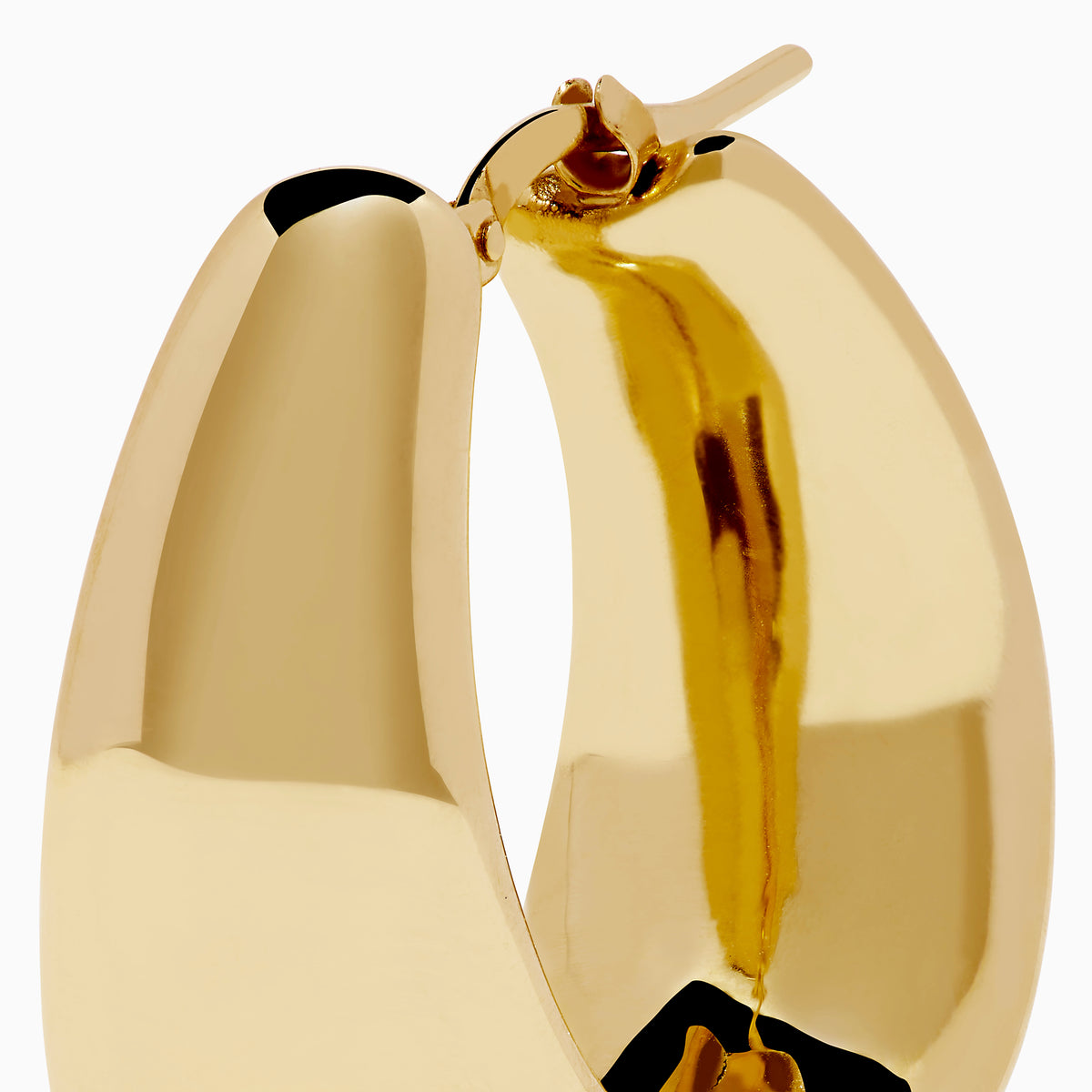 The 14K Yellow Gold High-Polish Tapered Wide Hoop Earrings feature a sleek, modern design with a sculptural, high-shine finish, shown against a plain white background.