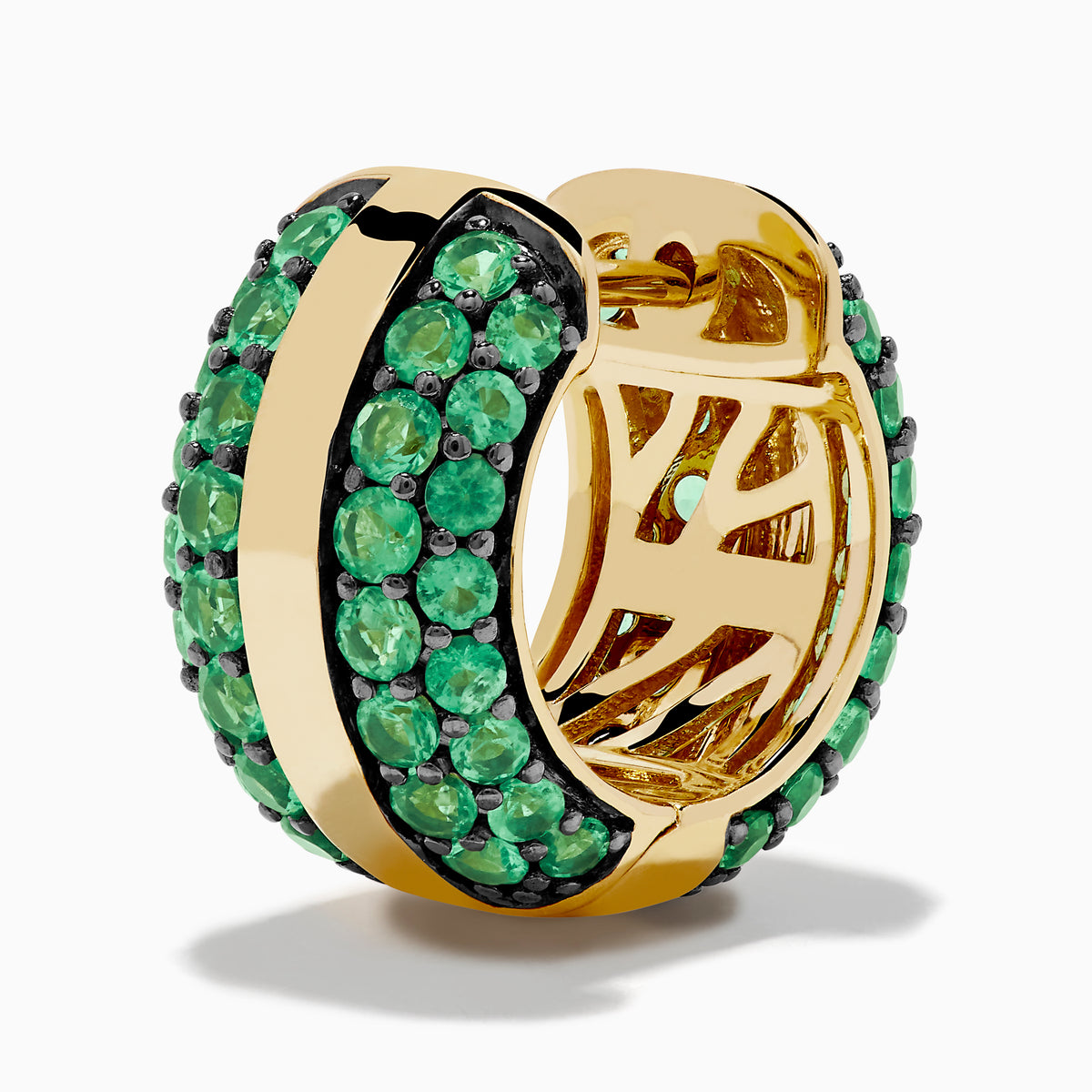 The 14K Yellow Gold Emerald Pave Huggie Earrings feature a central gold stripe flanked by pavé-set green gemstones, perfect as emerald huggies and displayed against a white background.
