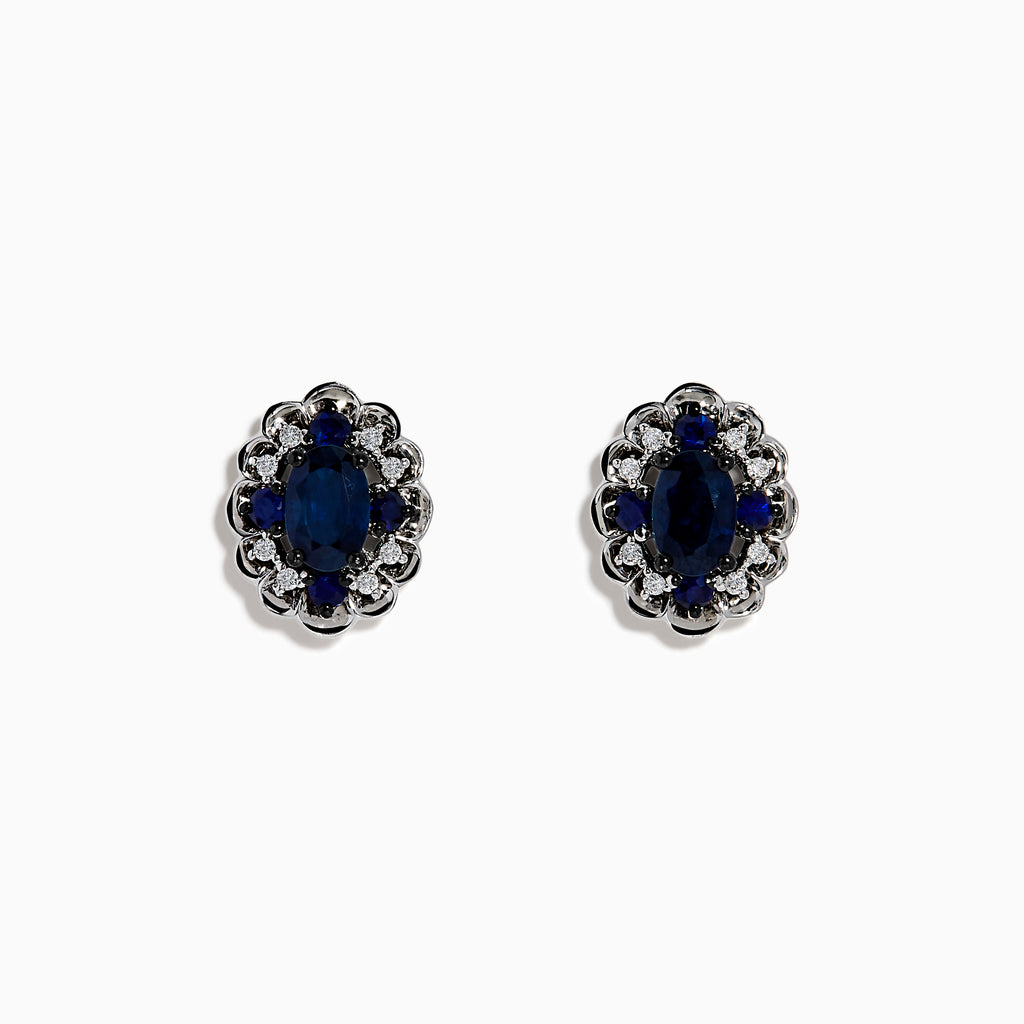 14K White Gold Sapphire and Diamond Vintage Halo Stud Earrings with oval blue sapphires surrounded by a halo of diamonds, shown on a white background.