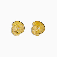A pair of 14K yellow gold stud earrings featuring a flower design accented with a diamond at the center, displayed on a white background.