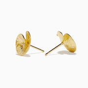 A pair of 14K yellow gold stud earrings featuring a flower design accented with a diamond at the center, displayed on a white background.