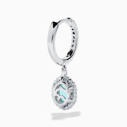 A pair of elegant 18K White Gold Paraiba and Diamond Oval Halo Drop Earrings, featuring vibrant oval Paraiba stones encircled by sparkling diamonds and additional gems on the hooks, displayed on a white background.