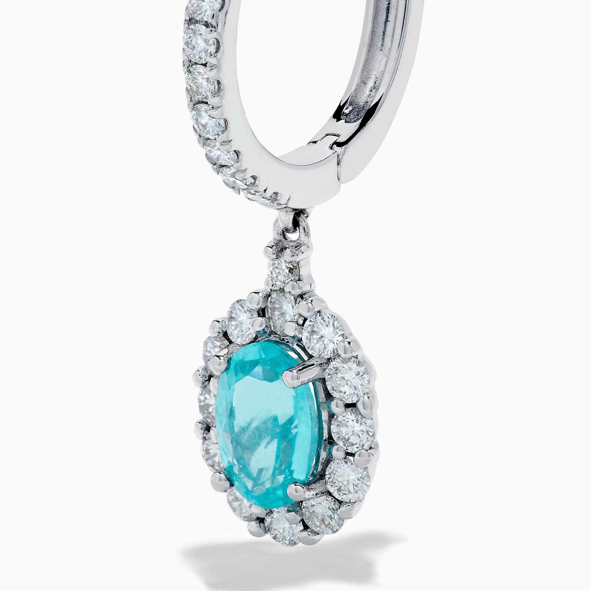 A pair of elegant 18K White Gold Paraiba and Diamond Oval Halo Drop Earrings, featuring vibrant oval Paraiba stones encircled by sparkling diamonds and additional gems on the hooks, displayed on a white background.