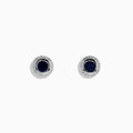 The 925 Sterling Silver Blue Sapphire Stud Earrings feature a round blue sapphire gemstone at the center of each stud, displayed against a white background.
