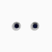 The 925 Sterling Silver Blue Sapphire Stud Earrings feature a round blue sapphire gemstone at the center of each stud, displayed against a white background.