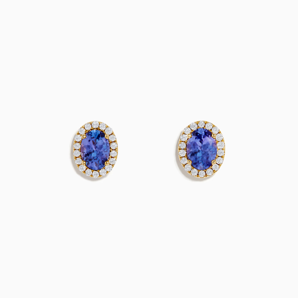 The Nahla 14K Yellow Gold Tanzanite and Diamond Stud Earrings feature oval blue tanzanites haloed by small diamonds, set in yellow gold and shown on a white background.