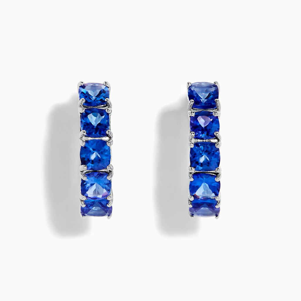 Nahla Siri Sterling Silver 7/8 Hoop Earrings, each featuring five cushion-cut tanzanite stones, displayed on a white background.
