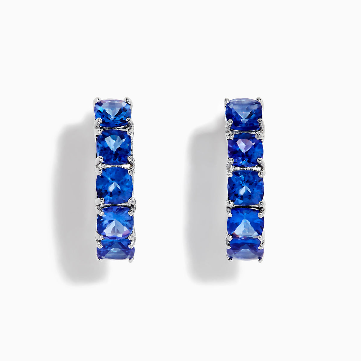 Nahla Siri Sterling Silver 7/8 Hoop Earrings, each featuring five cushion-cut tanzanite stones, displayed on a white background.