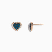 The Bella Bleu 14K Rose Gold Blue and White Diamond Heart Earrings showcase blue and white diamonds at the center, bordered by clear stones in a rose gold setting, displayed against a white background.