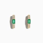 The Brasilica 14K Yellow Gold Emerald and Diamond Huggie Earrings feature rectangular green emeralds accented by rows of sparkling white diamonds, shown on a white background—an elegant, timeless accessory.