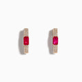 The Ruby Royale 14K Rose Gold Ruby and Diamond Huggie Earrings feature rectangular red rubies flanked by rows of sparkling white diamonds, set in rose gold and displayed against a white background.