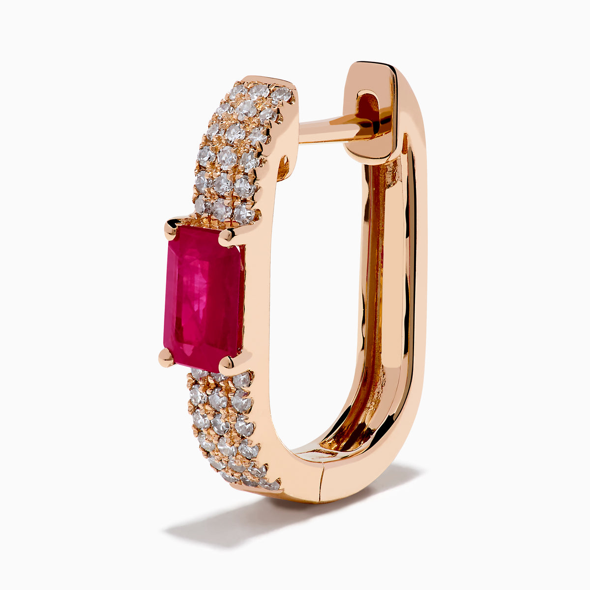 The Ruby Royale 14K Rose Gold Ruby and Diamond Huggie Earrings feature rectangular red rubies flanked by rows of sparkling white diamonds, set in rose gold and displayed against a white background.