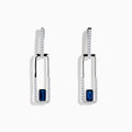 The Royale Bleu 14K White Gold Sapphire and Diamond Drop Earrings feature rectangular hoops adorned with diamonds and a central blue sapphire at the bottom of each elegant earring.