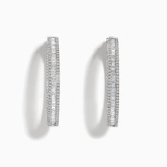 The Pave Classica 14 Karat White Gold Diamond 1.25 Hoop Earrings feature sparkling white diamonds totaling 2.24 TCW, set in elegant oval-shaped hoops and shown against a plain white background.