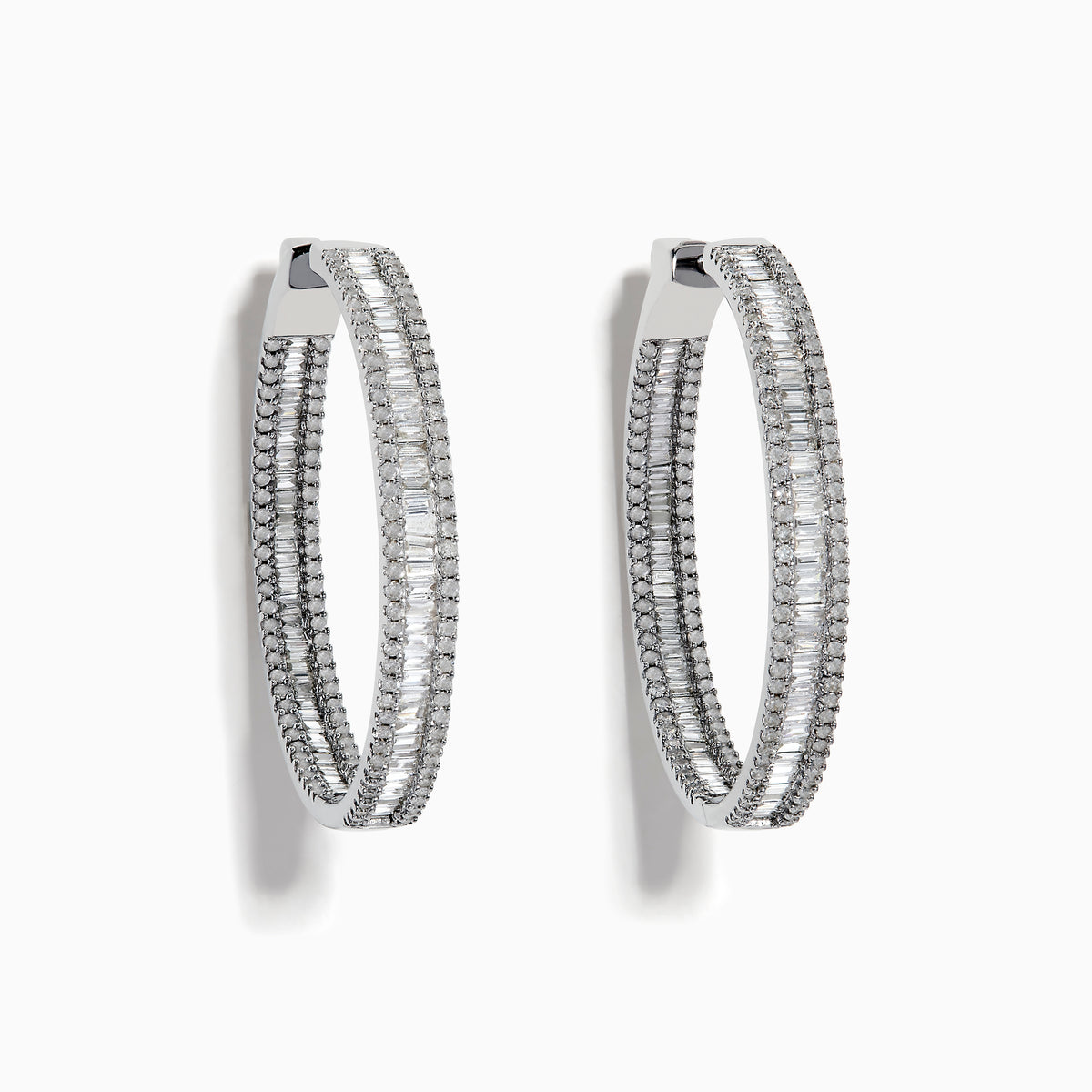 The Pave Classica 14 Karat White Gold Diamond 1.25 Hoop Earrings feature sparkling white diamonds totaling 2.24 TCW, set in elegant oval-shaped hoops and shown against a plain white background.