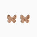 The 14K Rose Gold Diamond Butterfly Earrings, featuring sparkling crystals, are showcased on a white background.