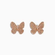 The 14K Rose Gold Diamond Butterfly Earrings, featuring sparkling crystals, are showcased on a white background.