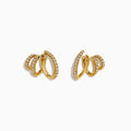 D’Oro 14K Yellow Gold Diamond Stud Earrings feature a spiral, overlapping design with sparkling diamonds along the curves, displayed against a plain white background.
