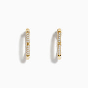 The DOro 14 Karat Yellow Gold 5/8 Diamond Bamboo Hoop Earrings, featuring sparkling diamonds in a bamboo-inspired design, are displayed on a plain white background.