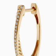 The DOro 14K Yellow Gold Diamond Hoop Earrings feature a subtle curve and sparkling diamonds along the front edge, beautifully showcased against a plain white background.