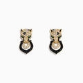 The Signature 14K Yellow Gold White and Black Diamond Panther Earrings feature panther head designs with white and black diamonds, green eye accents, and each holds a black circular ring in its mouth.