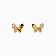 The Novelty 14K Yellow Gold Diamond Butterfly Stud Earrings feature one wing with sparkling diamonds and the other in polished gold, all crafted in 14K yellow gold and displayed on a plain white background.
