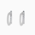 The Pave Classica 14K White Gold Diamond Hoop Earrings, adorned with small diamonds, are shown vertically against a plain white background with soft shadows.