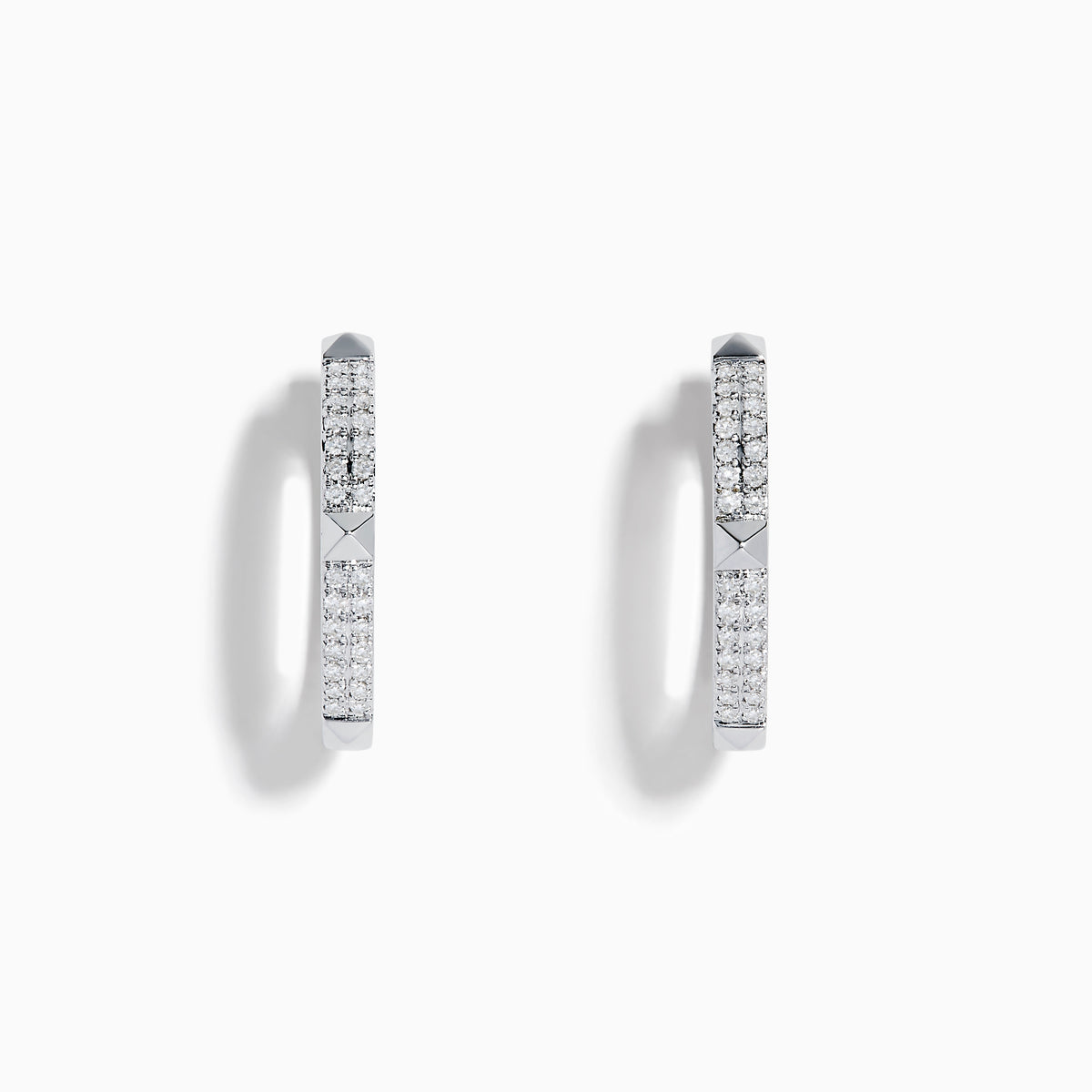 The Pave Classica 14K White Gold Diamond Hoop Earrings, adorned with small diamonds, are shown vertically against a plain white background with soft shadows.