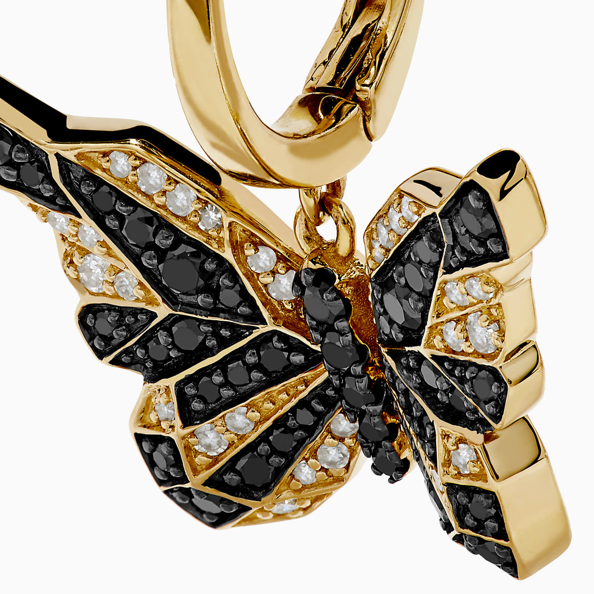 14K Yellow Gold Black and White Diamond Butterfly Earrings featuring a hoop design and geometric crystal pattern on the wings, shown against a white background.