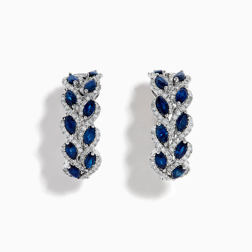 The 14K White Gold Sapphire and Diamond Leaf Motif Hoop Earrings feature marquise blue sapphires in a leaf design with diamond accents, set against a white background.