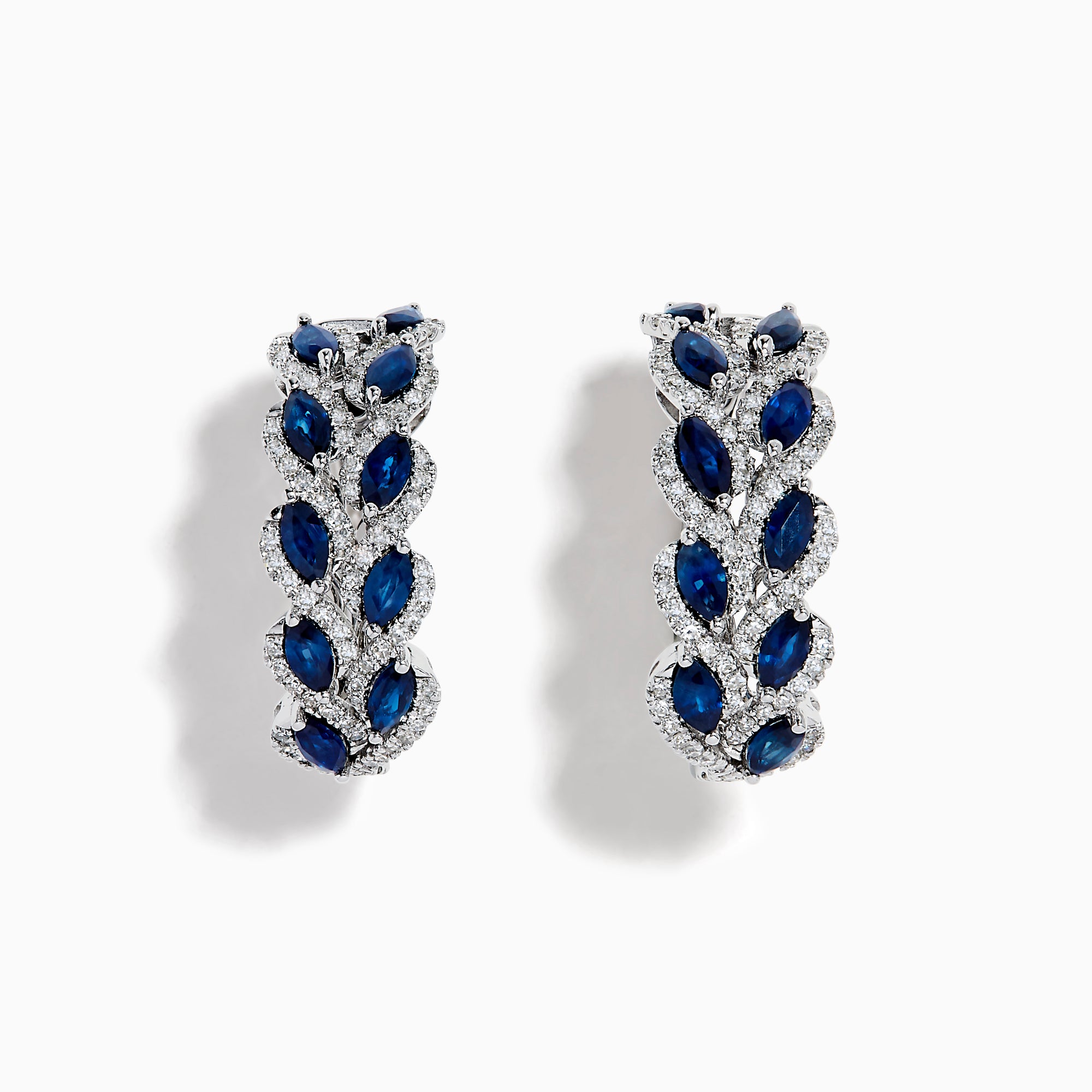 The 14K White Gold Sapphire and Diamond Leaf Motif Hoop Earrings feature marquise blue sapphires in a leaf design with diamond accents, set against a white background.
