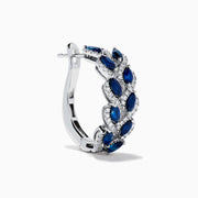 The 14K White Gold Sapphire and Diamond Leaf Motif Hoop Earrings feature marquise blue sapphires in a leaf design with diamond accents, set against a white background.