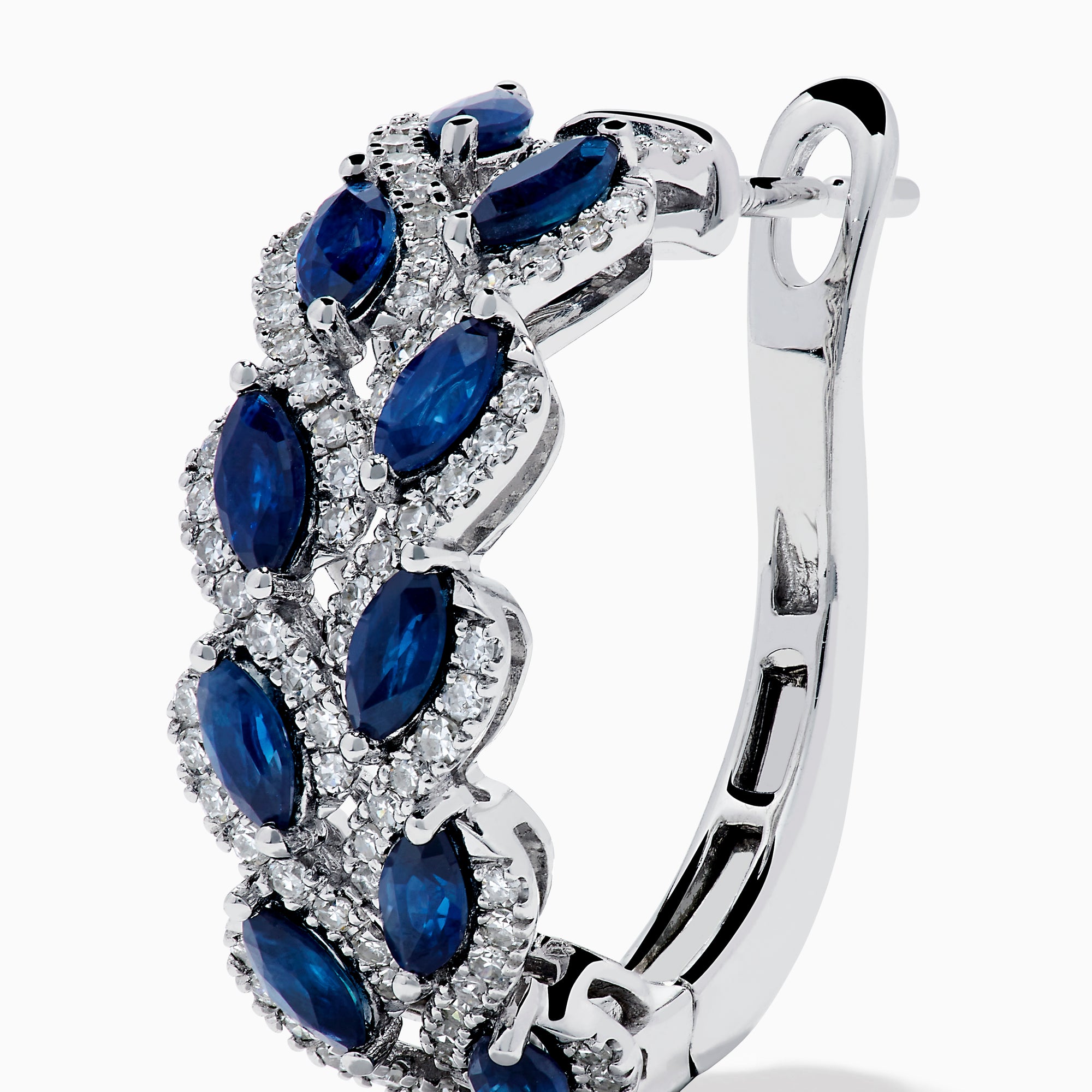 The 14K White Gold Sapphire and Diamond Leaf Motif Hoop Earrings feature marquise blue sapphires in a leaf design with diamond accents, set against a white background.