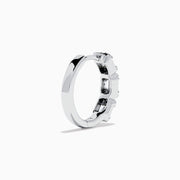 A pair of Classique 14K White Gold Diamond Hoop Earrings, featuring rectangular and round clear gemstones, shown on a white background with soft shadows to the left of each earring.