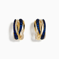 The 14K Yellow Gold Sapphire and Diamond Crossover Hoop Earrings feature intertwined bands set with blue sapphires and small clear diamonds, shown against a white background.