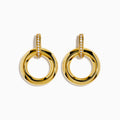 The 14K Yellow Gold Diamond Accented Circle Drop Earrings feature circular hoops with diamond accents on the upper bar, shown against a white background.