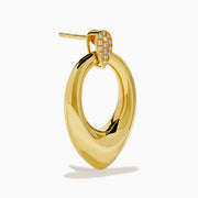 The 14K Yellow Gold Sculptural Diamond Accented Drop Earrings feature a teardrop outline and diamond accents at the top where they attach to the ear.