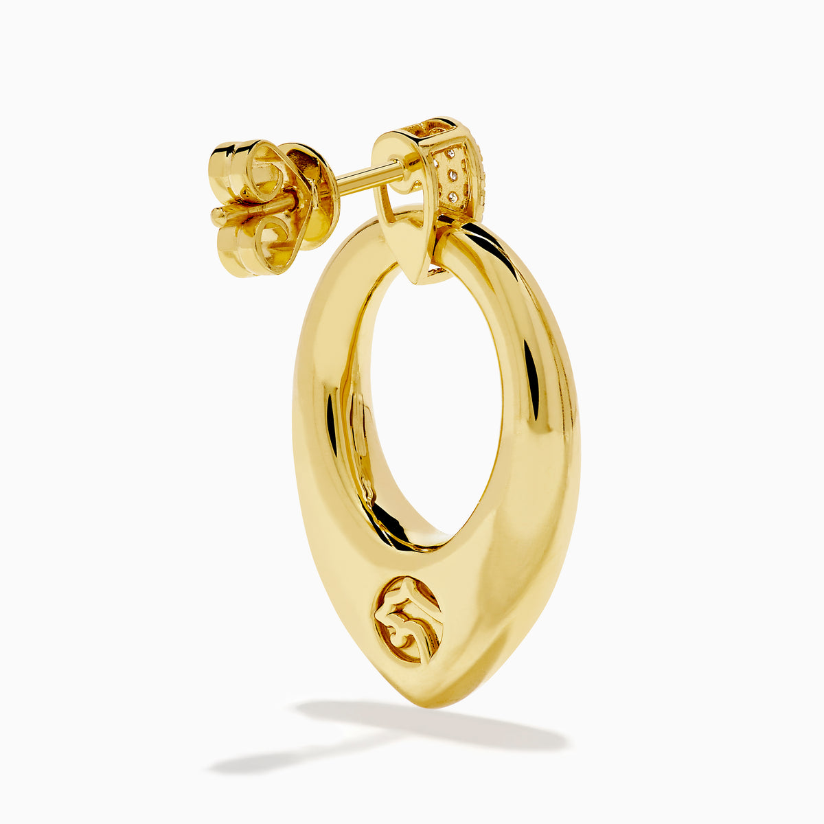 The 14K Yellow Gold Sculptural Diamond Accented Drop Earrings feature a teardrop outline and diamond accents at the top where they attach to the ear.