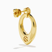 The 14K Yellow Gold Sculptural Diamond Accented Drop Earrings feature a teardrop outline and diamond accents at the top where they attach to the ear.