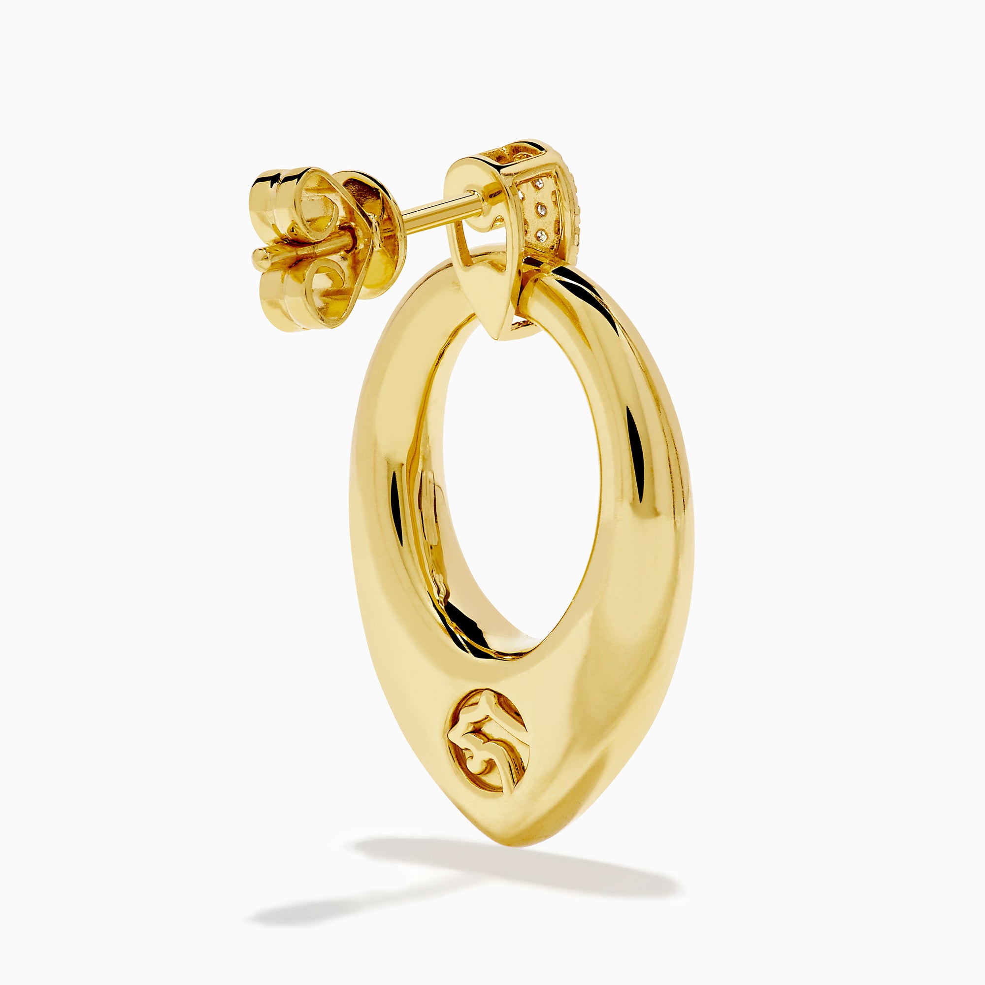 The 14K Yellow Gold Sculptural Diamond Accented Drop Earrings feature a teardrop outline and diamond accents at the top where they attach to the ear.