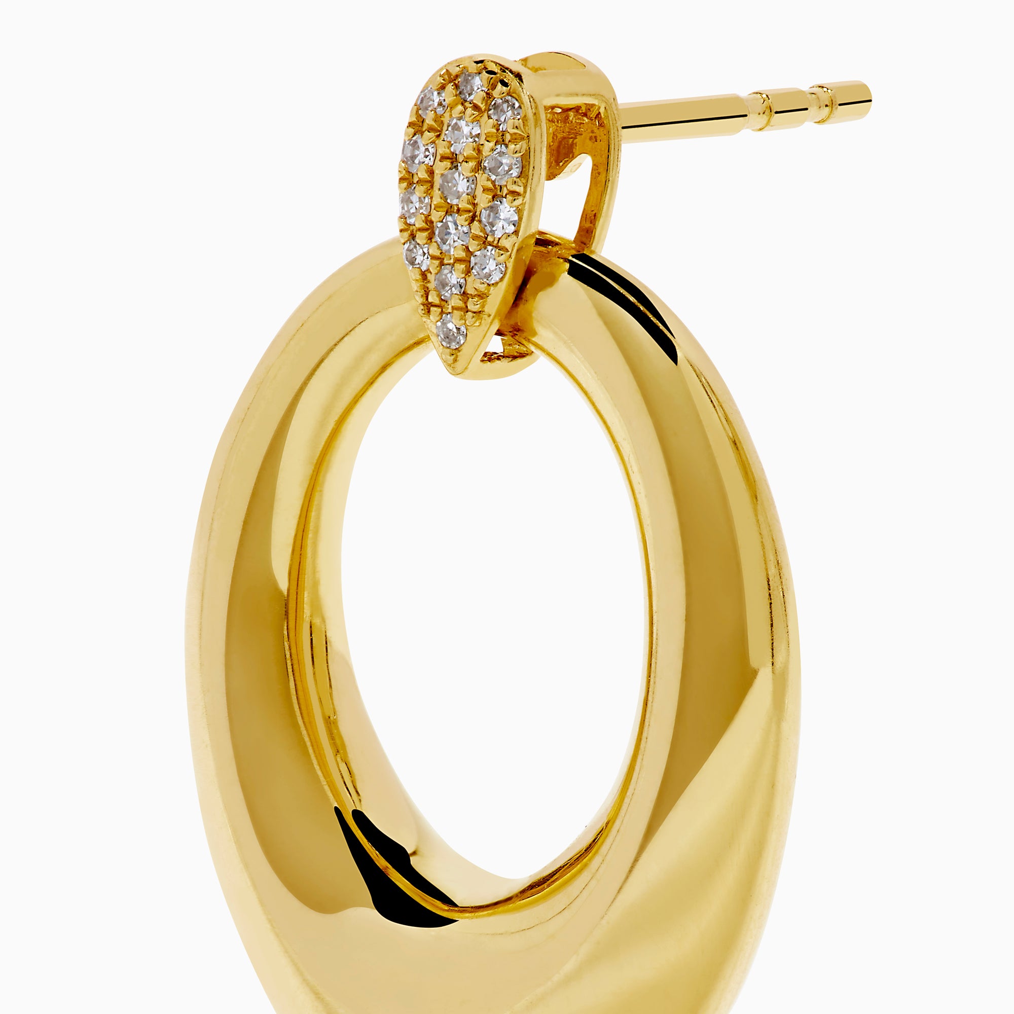 The 14K Yellow Gold Sculptural Diamond Accented Drop Earrings feature a teardrop outline and diamond accents at the top where they attach to the ear.