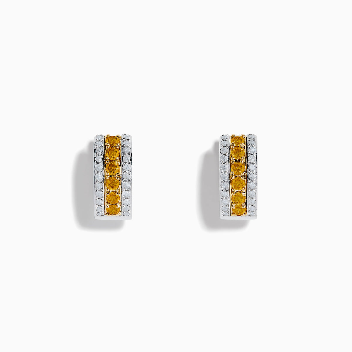 The Canare 14K Two Tone Gold Yellow and White Diamond Huggie Earrings showcase a central row of yellow diamonds bordered by two rows of white diamonds, all set in a striking two-tone gold design.