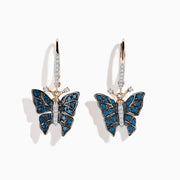 The 14K Rose Gold White and Blue Diamond Butterfly Earrings feature delicate butterfly designs with blue and white diamond accents on rose gold hooks, set against a white background.