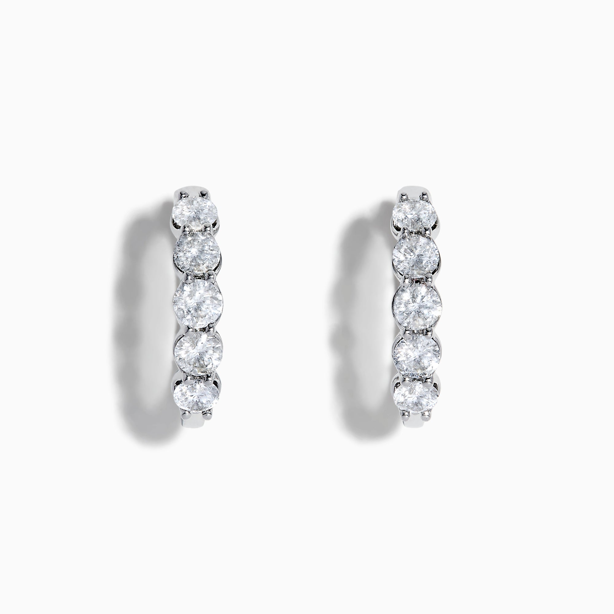 The Classique 14K White Gold Diamond Hoop Earrings feature five round diamonds on each hoop, shown against a white background for a timeless look.